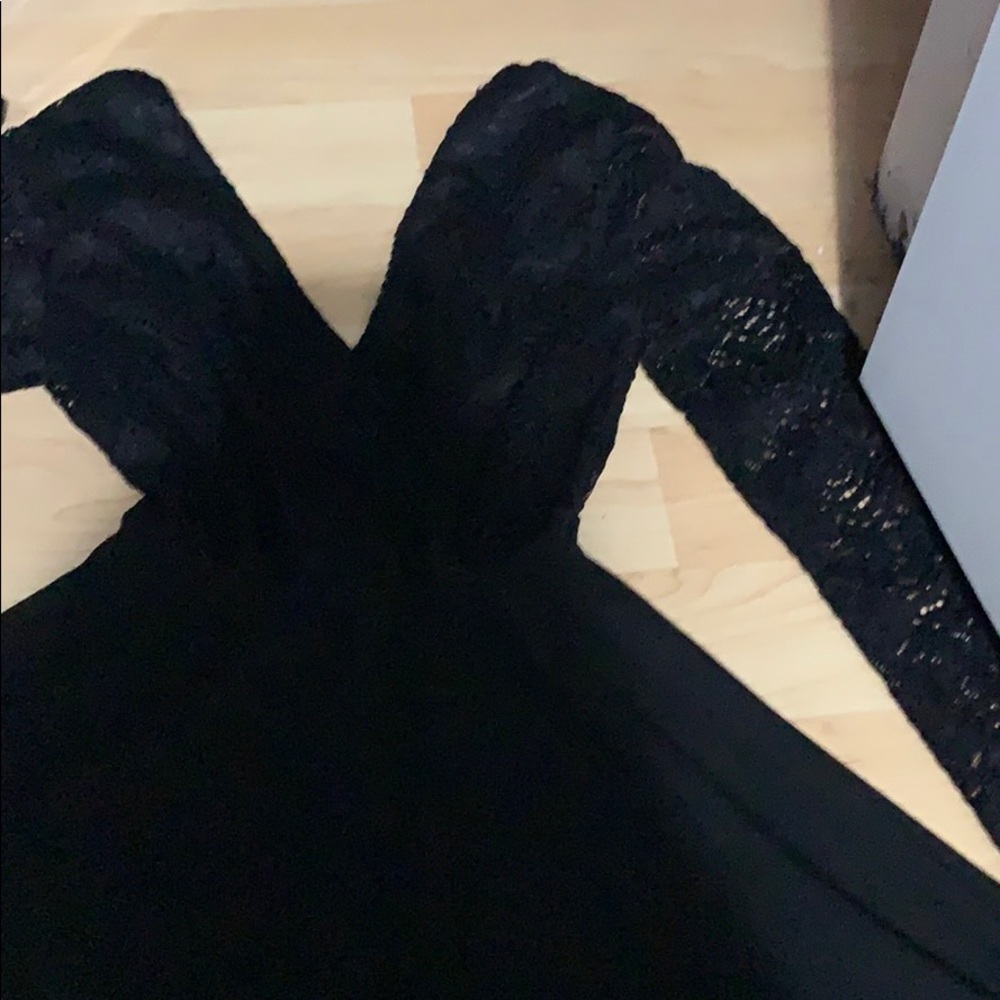 Homecoming black low cut dress with lace sleeves
